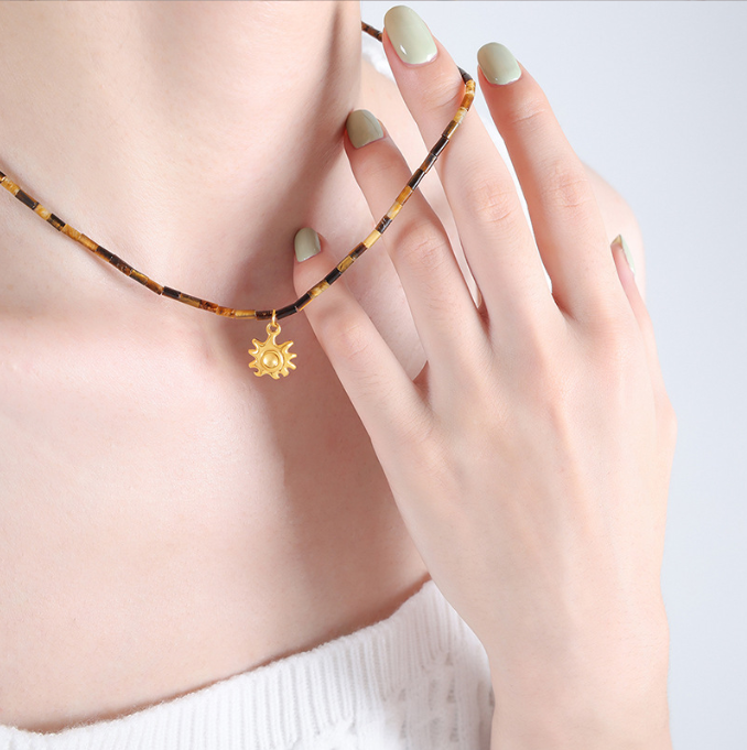 Fashionable titanium steel jewelry with tiger eye stone beads paired with small sun pendant collarbone design sense of niche