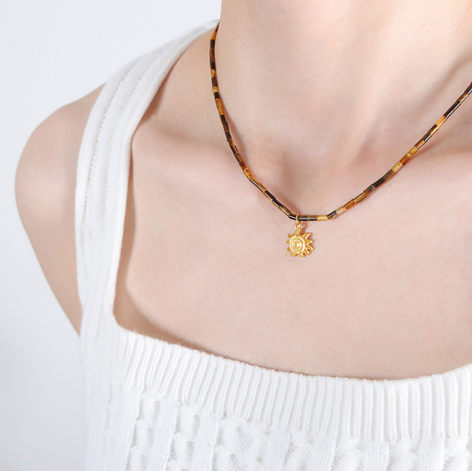 Fashionable titanium steel jewelry with tiger eye stone beads paired with small sun pendant collarbone design sense of niche