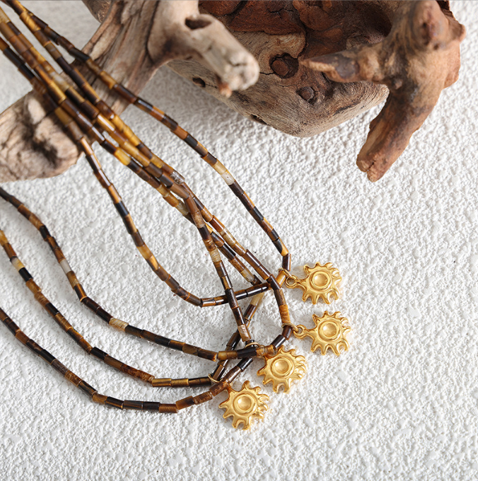 Fashionable titanium steel jewelry with tiger eye stone beads paired with small sun pendant collarbone design sense of niche